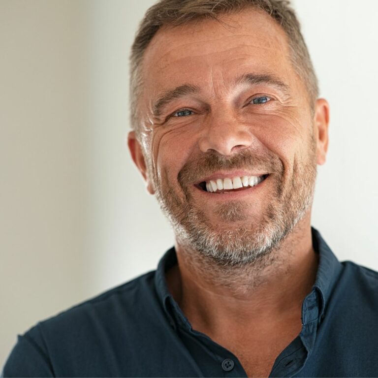 A happy man smiling confidently