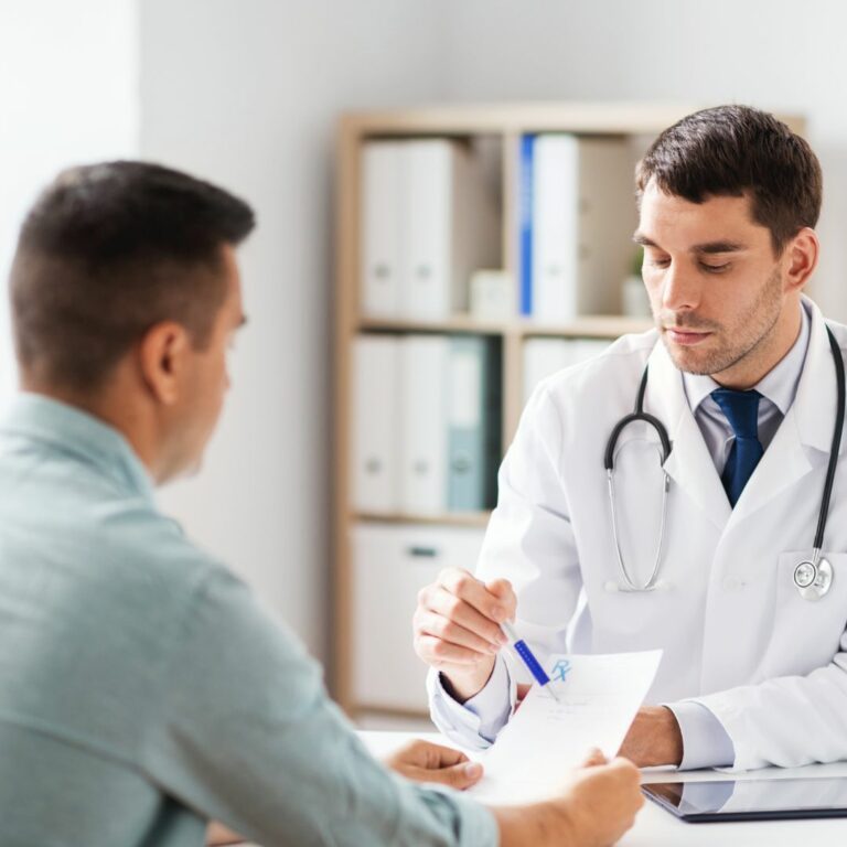 doctor and a man engaged in discussion